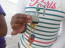 Image of student unlocking a lock as part of a Healthy Futures activity